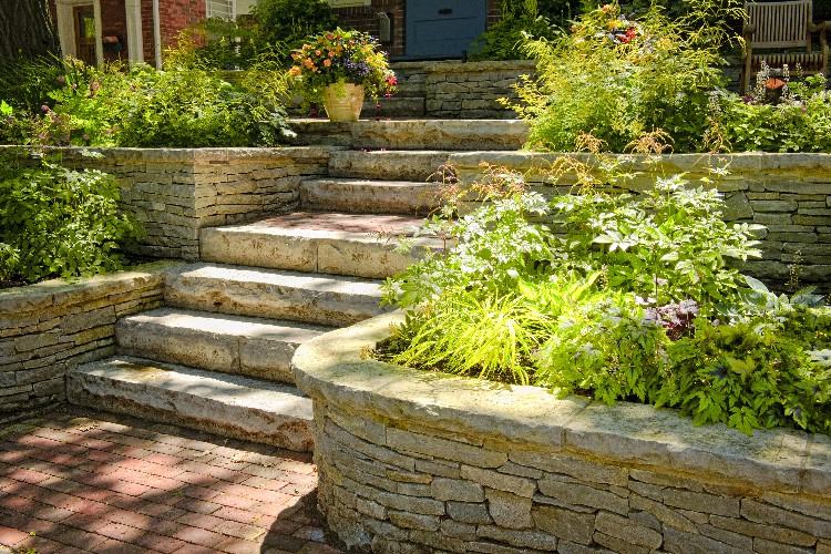 Natural stone landscaping in home garden with stairs